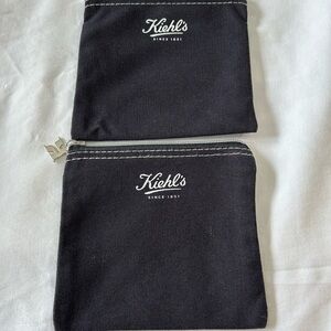 Kiehl's cosmetic small bag / pouch with a zipper closure and white stitching.